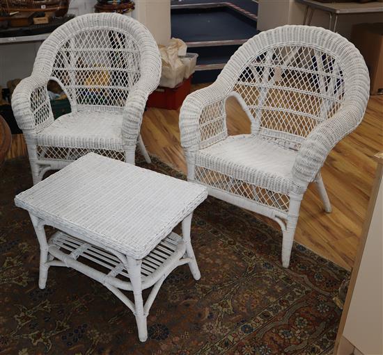 A painted wicker settee, table and a pair of chairs Settee W.136cm